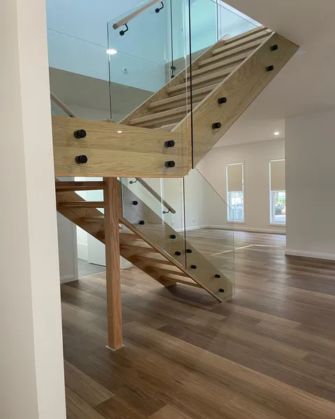 Timber handrail on a glass balustrade