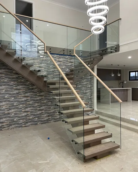 Glass balustrade on stone stairs