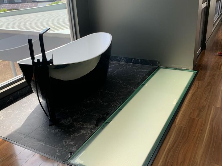 Bespoke structural glass floor panel in a commercial building